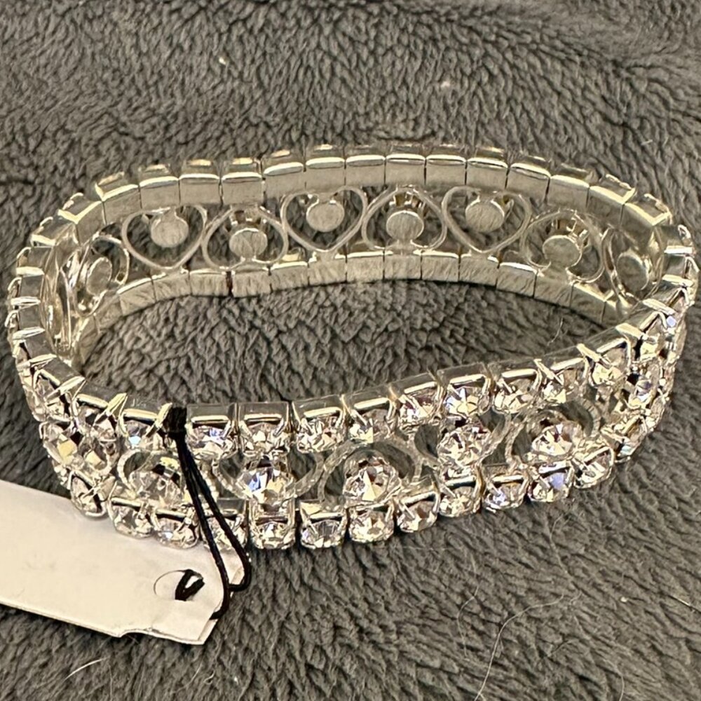 Silvertone stretch bracelet, with hearts and cubic zerconia by Thalia Soda.
